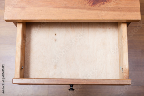 Photo top view of empty open drawer
