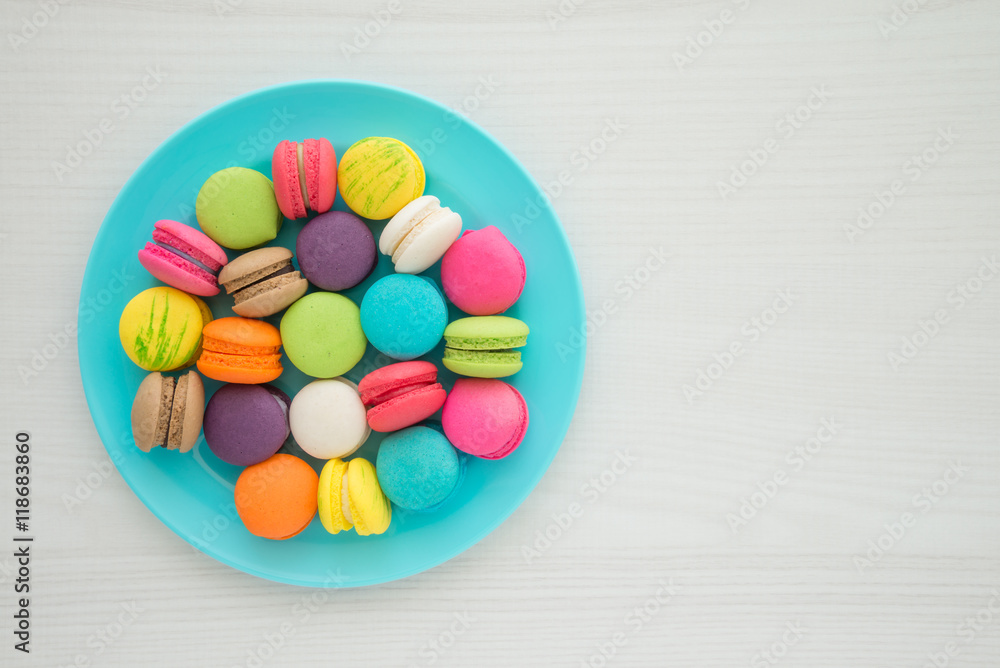 Colorful france macarons on white table background Colorful france macarons on white table background