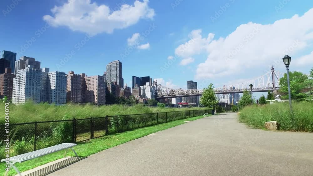 The Manhattan skyline and Ed Koch Queensboro Bridge as seen from the sidewalks and paths on Roosevelt Island. The Manhattan skyline and Ed Koch Queensboro Bridge as seen from the sidewalks and paths on Roosevelt Island.
