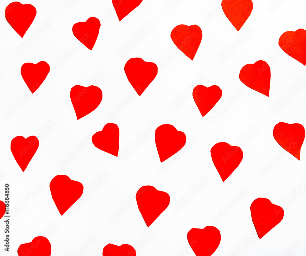 red hearts cut out from paper on white