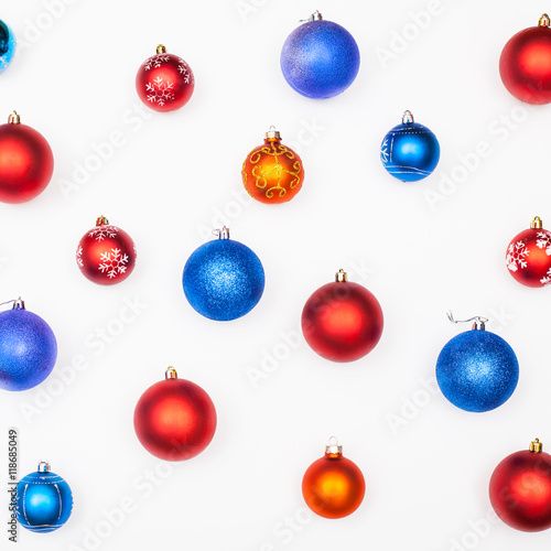 various blue, red, orange christmas balls on white