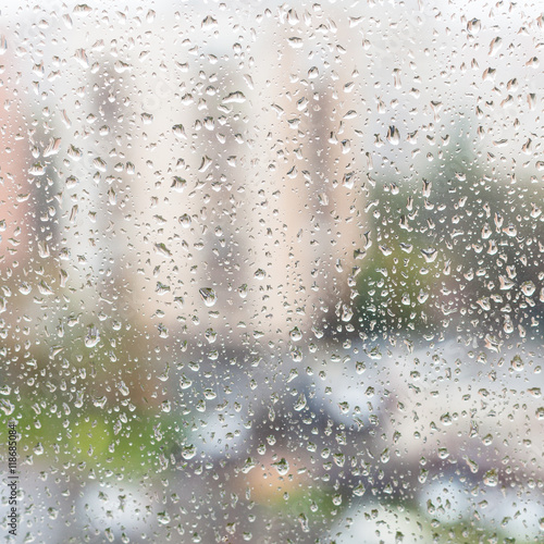 rain drops on window glass of apartment house