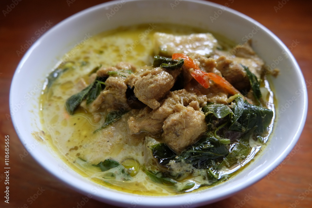 green curry chicken in coconut milk in bowl
green curry chicken in coconut milk in bowl