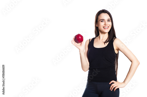 athletic girl with apples. Portrait of beautiful caucasian sport