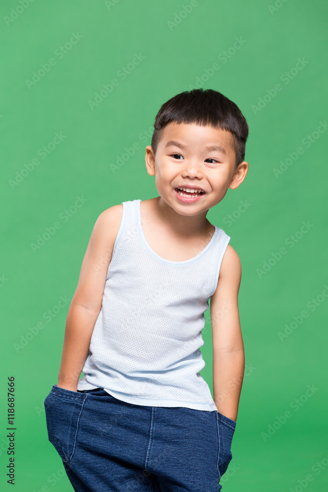 Cute little boy over green background Cute little boy over green background