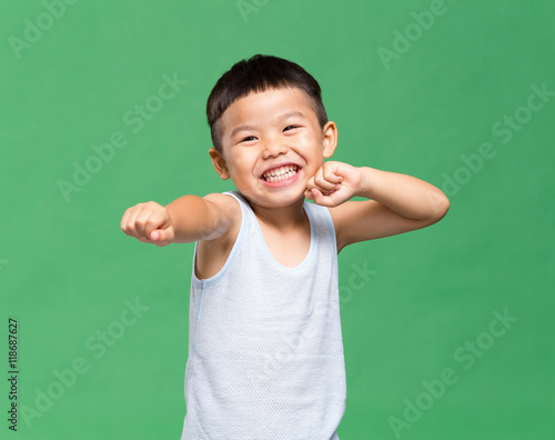 Little boy doing Kung Fu gesture