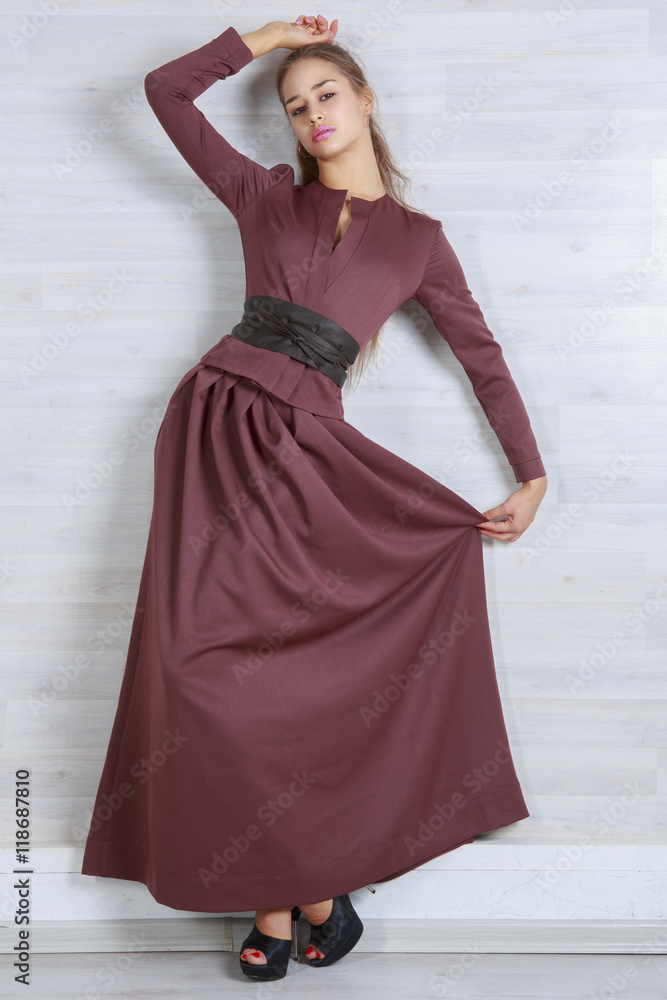 Portrait of beautiful girl in dress chocolate brown in the Studio Portrait of beautiful girl in dress chocolate brown in the Studio
