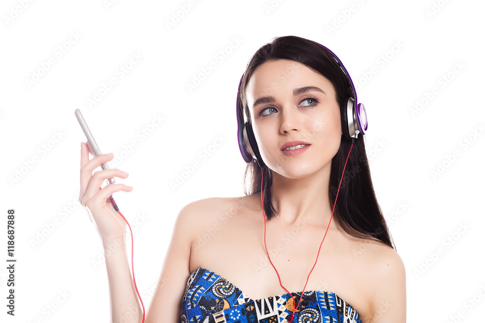 beautiful cute brunette girl with headphones on a white backgrou beautiful cute brunette girl with headphones on a white backgrou