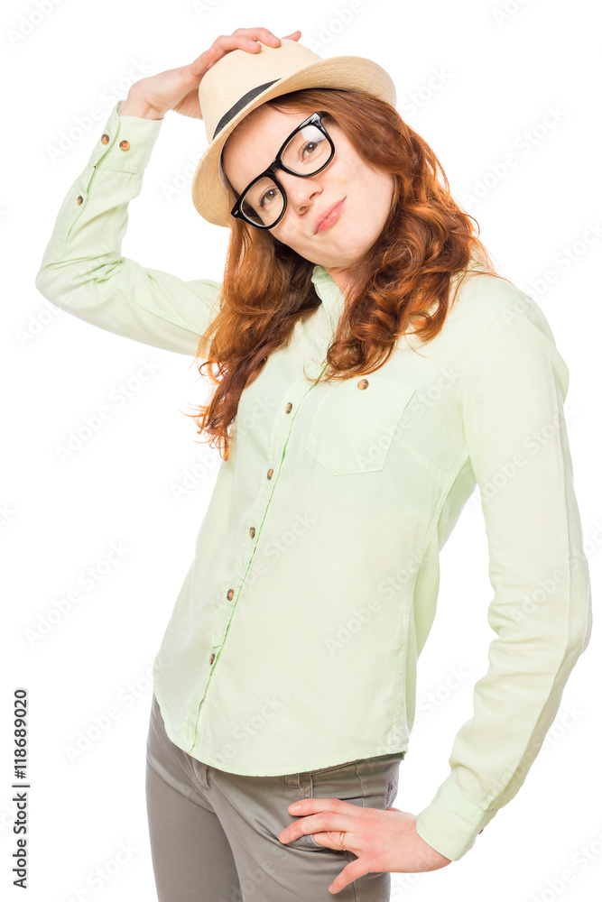beautiful woman corrects a stylish hat, portrait on a white back beautiful woman corrects a stylish hat, portrait on a white back