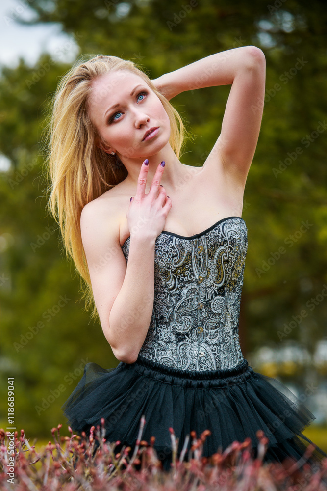 Portrait of beautiful girl in black dress in nature Portrait of beautiful girl in black dress in nature