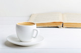 Cup of espresso and book