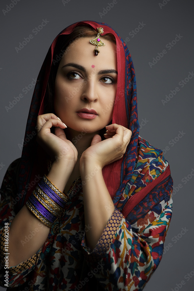 Portrait of a beautiful woman in traditional clothes of India