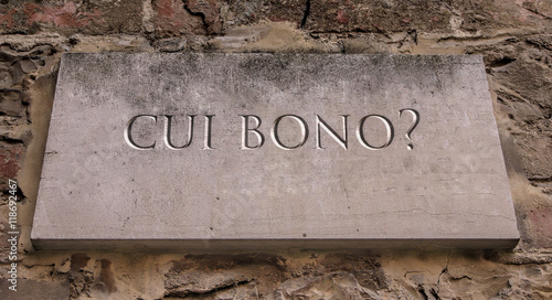 Cui bono? Literally To whose profit?, is a Latin phrase which is still in use as a key forensic question in legal and police investigation. Engraved text.