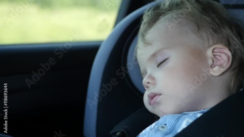 the baby is sleeping in the car in the way
