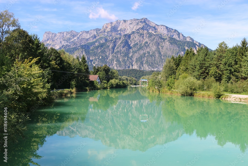 Beautiful landscape with the Salzach river; a goal for canoe polo is placed in the middle of the river. In the background the mountain Untersberg. Puch, near the city Salzburg, Austria.