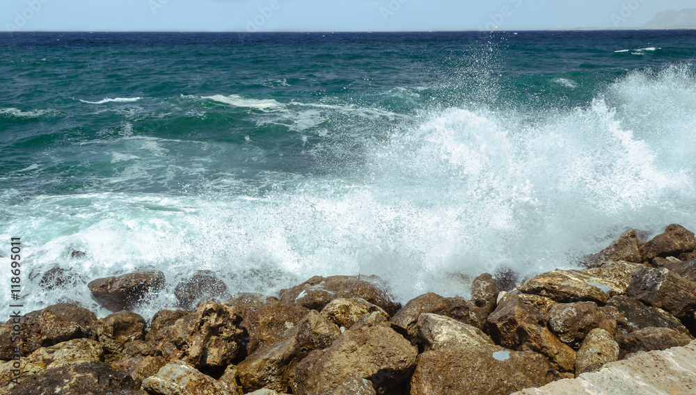 A big wave hits the rocks