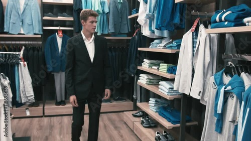 Man buys classic clothes and shoes in shop