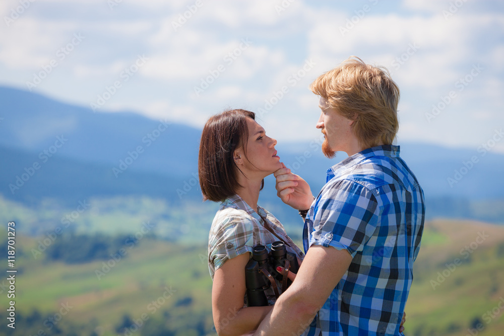 Beautiful couple walking together at the summer meadow Beautiful couple walking together at the summer meadow