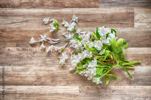 withered flowers on the wooden grunge floor  hdr image