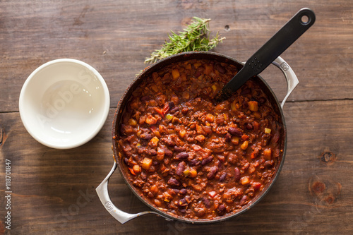 Organic Vegetarian Chili In Iron Pot Served With Rosemary On Dis