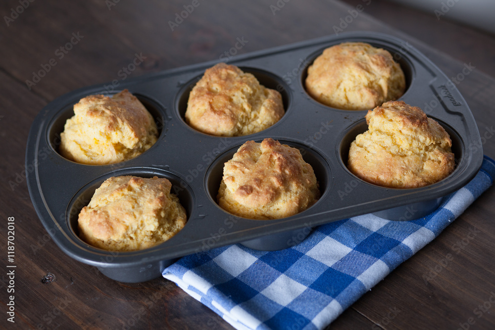 Corn Bread Muffins In Muffin Pan On Country Distressed Wood Tabl Corn Bread Muffins In Muffin Pan On Country Distressed Wood Tabl