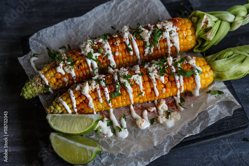 Elote or Mexican grilled corn on the cob served with cotija cheese and chili powder.