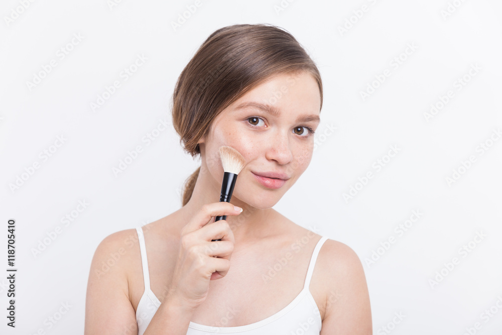 Attractive girl with makeup brush Attractive girl with makeup brush