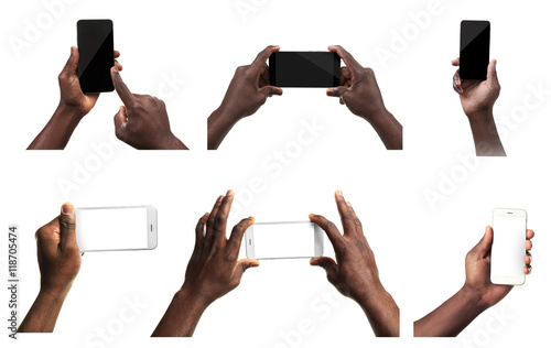 Male hands holding mobile smart phone and tablet with blank screen, isolated on white.