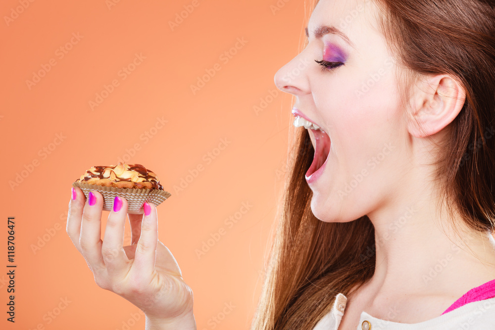 woman face profile holds cake in hand woman face profile holds cake in hand