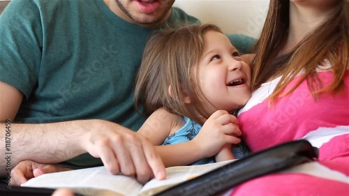 Young family studying the Word of God