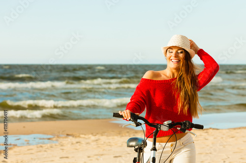 Fashionable girl with bike outdoor.