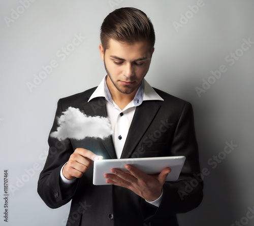 Businessman using tablet on...