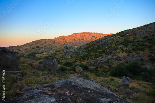 Beautiful landscape in the mountains in summer. It is an orange sunset in Spain. 