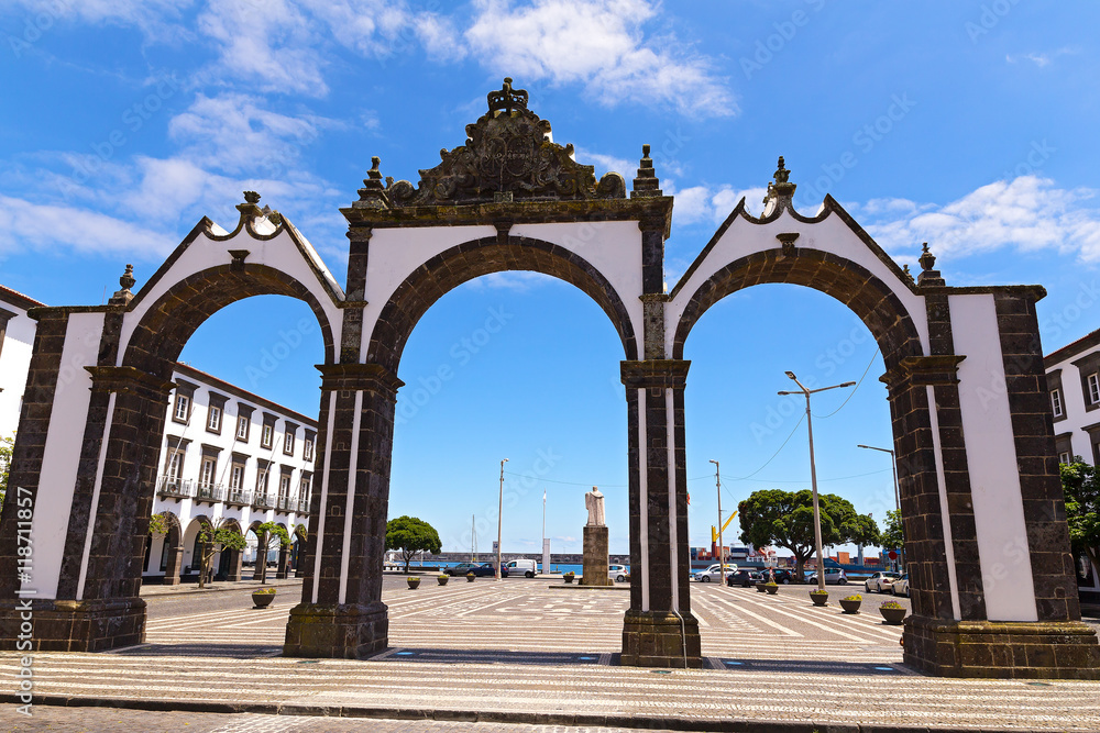 Portas da Cidade gates in Ponta Delgada, the capital of Azores, Portugal. Town square with the historical entrance overlooking the ocean.