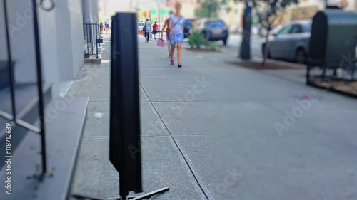 Wallpaper Mural An eye-catching spinning WINE advertisement sign on the sidewalk outside of a liquor store in a large city.  	 Torontodigital.ca