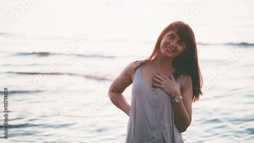 Beautiful girl on the sea in the evening