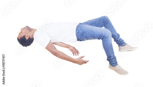 Interracial man floating on white background 