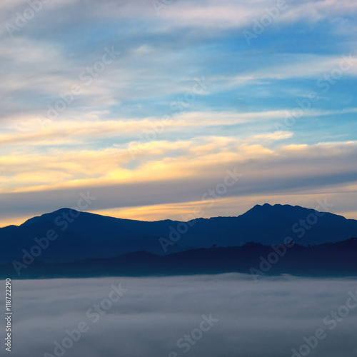 The sunrise, fog and mountain peaks.