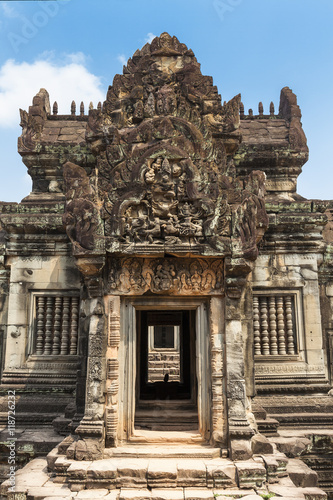Gate in a Banteay Samre hindu temple, Angkor, Cambodia. Blue sky background