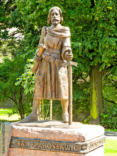 Statue of a knight with a sword and parchment in Rzeszow, Poland.