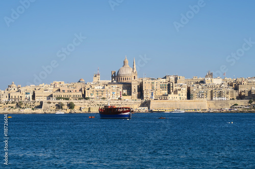 Valletta, Malta. Dome of Roman Catholic Basilica of Our Lady of Mount Carmel. St Paul's Pro-Cathedral landmark tower also visible. The Basilica is part of the UNESCO World Heritage Site.