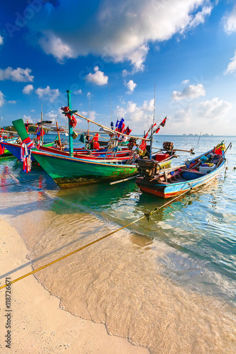 Thai traditional Fishing boat decorated with colorful ribbons © sergeytimofeev