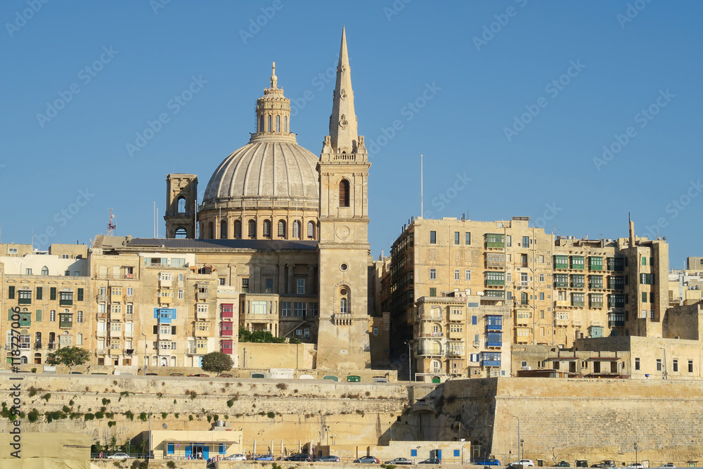 Valletta, Malta.  View of Basilica of Our Lady of Mount Carmel.  One of three cathedrals of the Anglican Diocese of Gibraltar in Europe St Paul's Pro-Cathedral tower is also visible.