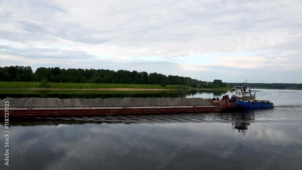 Dry cargo barge floats on the river Volga Dry cargo barge floats on the river Volga