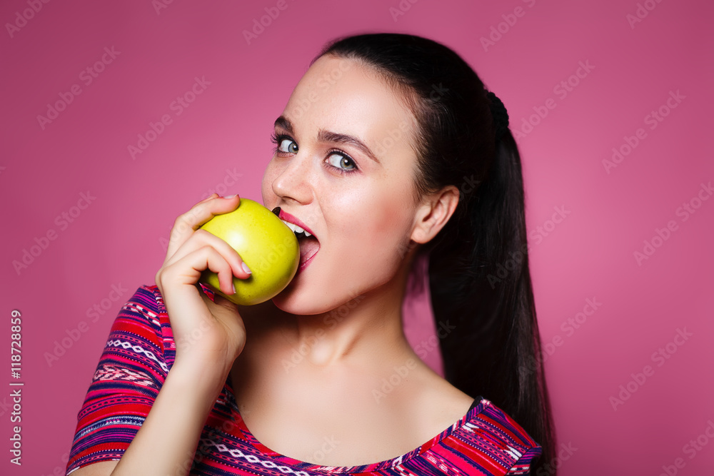 beautiful girl bites an apple with a smile, healthy teeth beautiful girl bites an apple with a smile, healthy teeth
