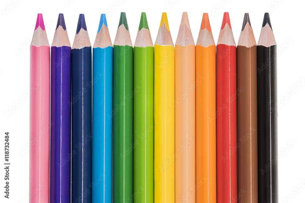 Colored pencils in row over white background Colored pencils in row over white background