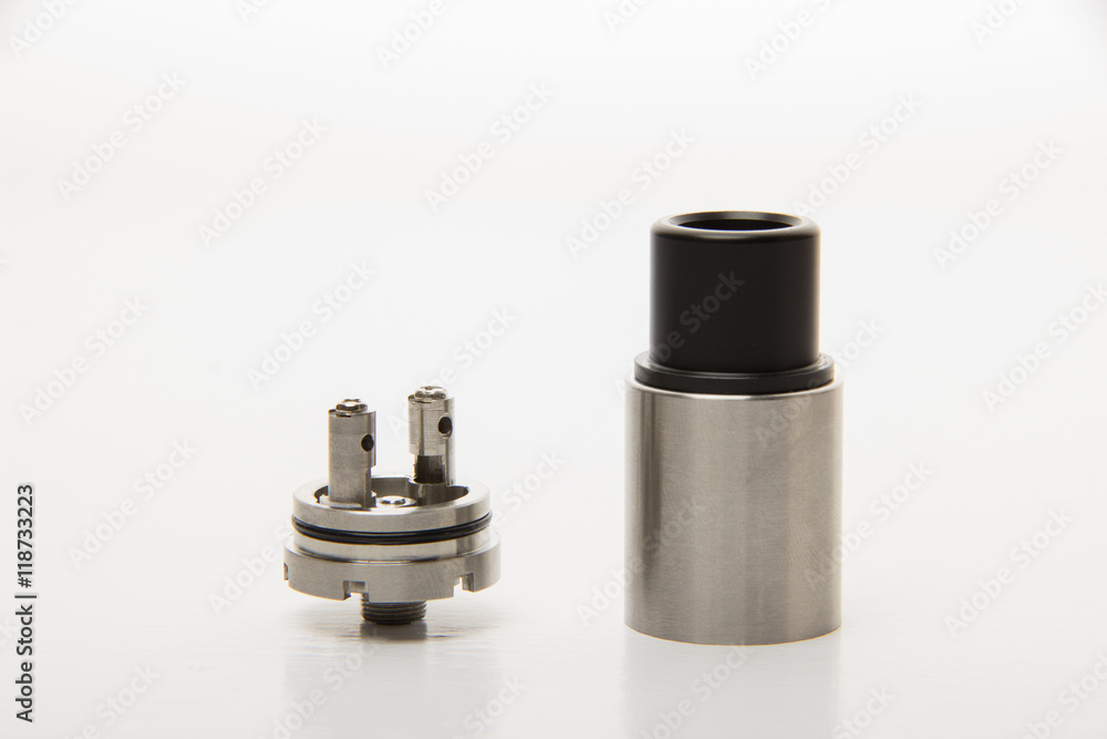 Dismantled parts of the electronic cigarette on a white backgrou Dismantled parts of the electronic cigarette on a white backgrou