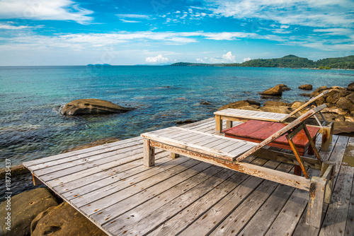 Beautiful tropical island beach with daybed - Travel summer holiday vacation concept