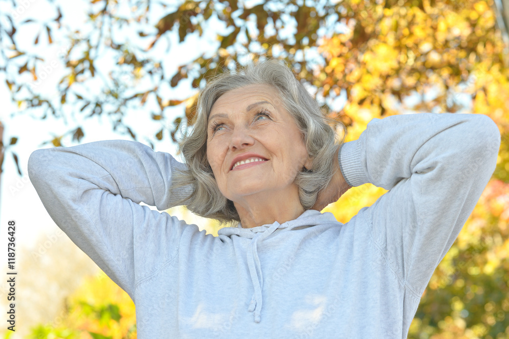 senior woman in autumn park senior woman in autumn park
