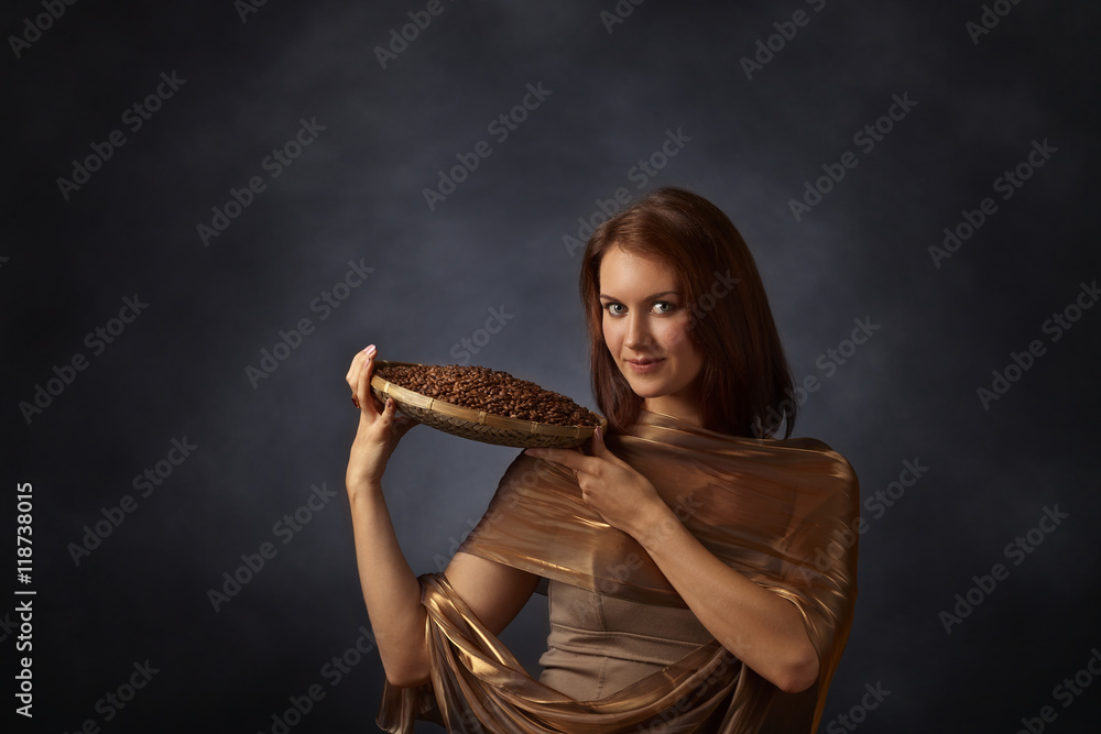 Young pretty woman with coffee beans